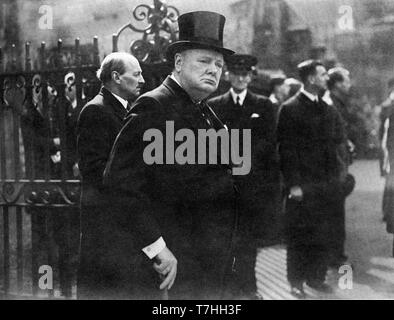 Winston Churchill leaving Westminster Abbey with Clement Attlee after Lloyd George's memorial service. 11th April 1945 Stock Photo