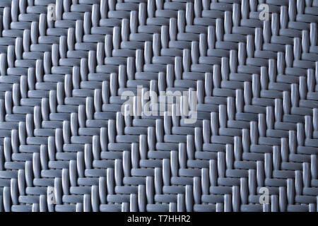 close up of blue artificial rattan plastic lined knitted ready for outdoor table or chair production in the furniture factory. texture and background  Stock Photo