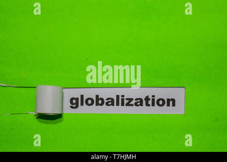 Globalization, Inspiration and business concept on green torn paper Stock Photo