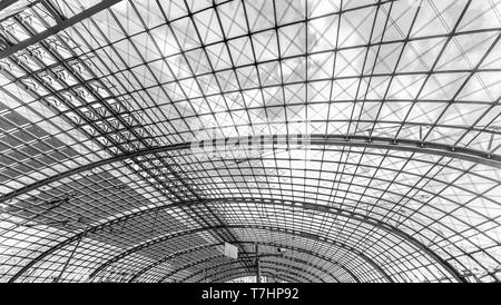 Berlin, Germany, August 18, 2018. Glass ceiling on a sunny day at the central railway station in Berlin uncolored, black and white Stock Photo
