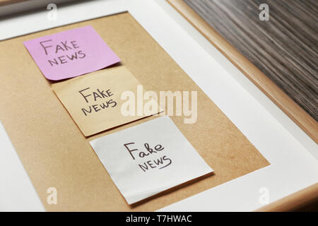 Stickers with words FAKE NEWS in frame, closeup Stock Photo