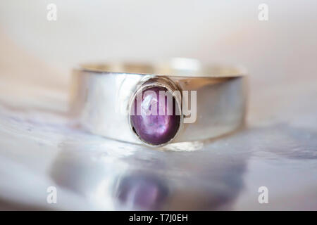 Beautiful silver ring with natural ruby star gemstone Stock Photo