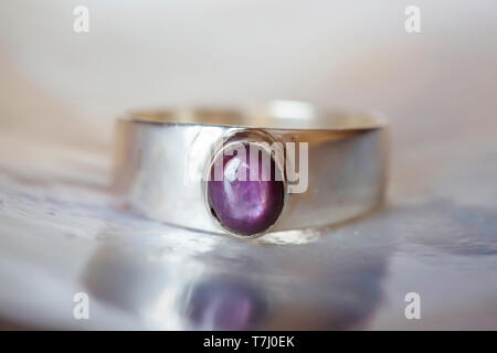 Beautiful silver ring with natural ruby star gemstone Stock Photo
