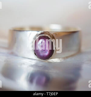 Beautiful silver ring with natural ruby star gemstone Stock Photo