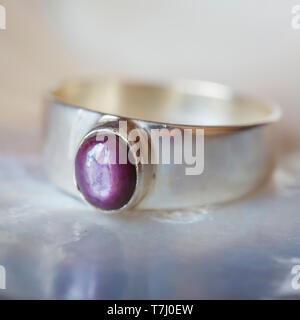 Beautiful silver ring with natural ruby star gemstone Stock Photo