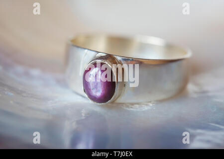 Beautiful silver ring with natural ruby star gemstone Stock Photo