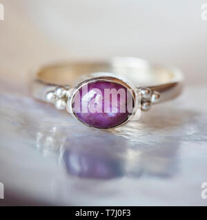 Beautiful silver ring with natural ruby star gemstone Stock Photo