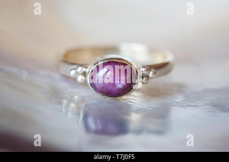 Beautiful silver ring with natural ruby star gemstone Stock Photo