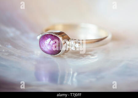 Beautiful silver ring with natural ruby star gemstone Stock Photo