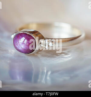 Beautiful silver ring with natural ruby star gemstone Stock Photo