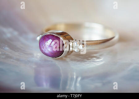 Beautiful silver ring with natural ruby star gemstone Stock Photo