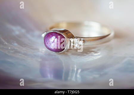Beautiful silver ring with natural ruby star gemstone Stock Photo