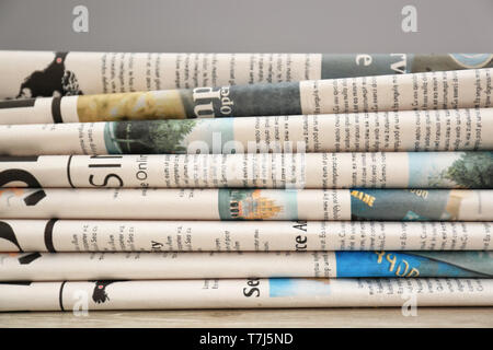 Various newspapers on table, closeup Stock Photo