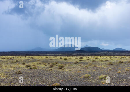 Landscape of a storm over the volcanoes of Timanfaya national park, in Lanzarote Stock Photo