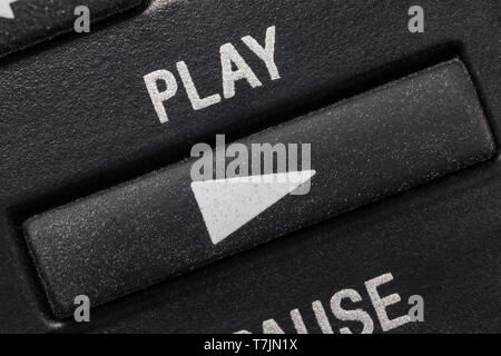 Television remote control play button macro close up detail. Stock Photo