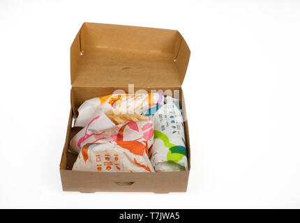 Taco Bell Loaded Taco Box containing crunchy hard shell taco, spicy loaded nacho soft taco, beefy 5 layer burrito and cinnamon twists Stock Photo