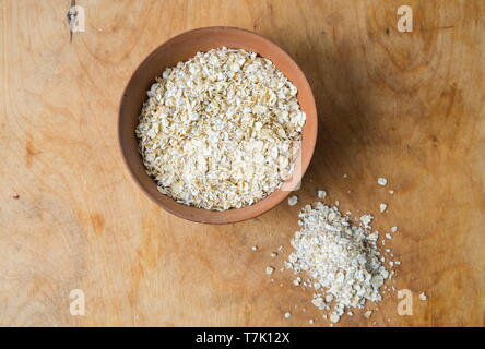 Oats in the bowl on table Stock Photo