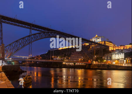 Dom Luis I Bridge by night in Porto, Portugal, Douro River waterfront Stock Photo