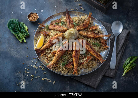 Persian herbed rice sabzi polo with fried red mullet, copy space Stock Photo