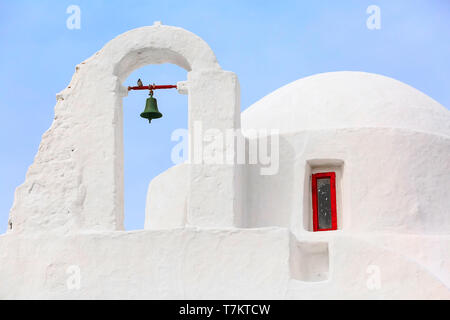 White Paraportiani Church on the island of Mykonos, Greece close-up bell tower with blue sky background Stock Photo