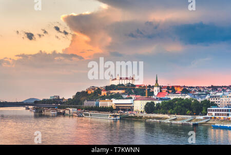 Cityscape of Bratislava, Slovakia at Sunset  as Seen from a Bridge over Danube River Towards Old Town of Bratislava. Stock Photo