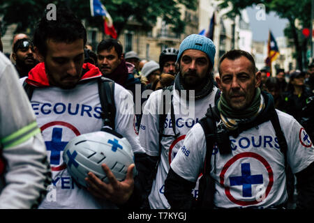 Paris France May 04, 2019 View of French street medic walking in the street during protests of the Yellow jackets Stock Photo