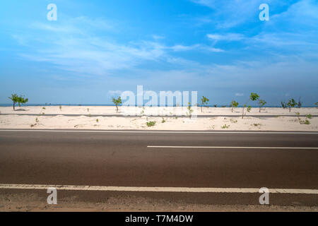 View of the road the with sandhill in Phan Thiet, southern Vietnam. Phan Thiet is a coastal port city in Southeast Vietnam. Stock Photo