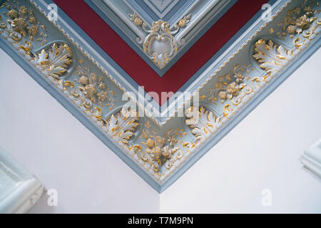 Stucco and luxurious decorative elements on ceiling. Luxury aesthetic in a modern home decor Stock Photo