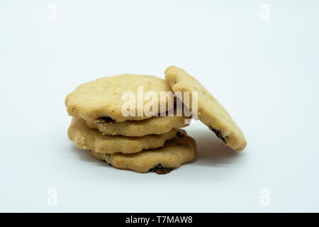 Five Delicious Crumbly Shortbread Raisin Biscuits on a white background A good image for a bakery or delicatessen or pastry chef. Stock Photo