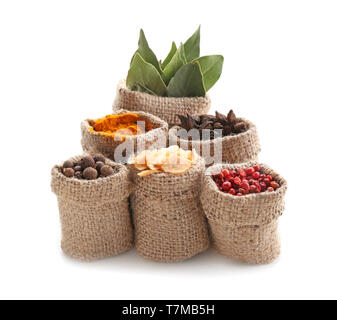Sacking bags with various spices on white background Stock Photo