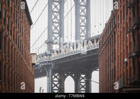 The famous view of the heart of the Manhattan bridge at Dumbo in the streets of Brooklyn, New York Stock Photo