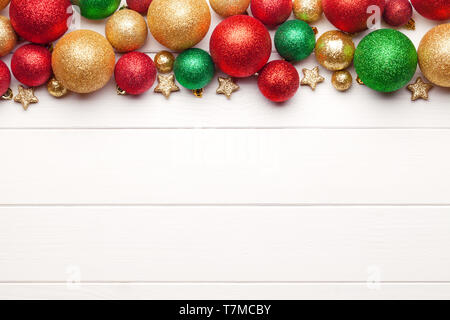 Christmas baubles on white wooden background Stock Photo