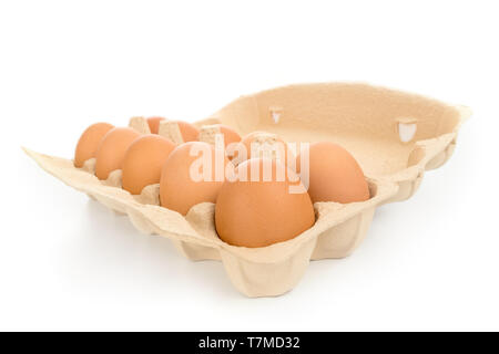 Pack of large brown hen eggs with cardboard box wide angle view isolated on white Stock Photo