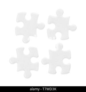 Four white jigsaw puzzle pieces set. Isolated on white, clipping path included Stock Photo