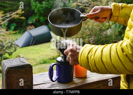 Brewing coffee at the campsite at Pumalin National Park, Patagonia, Region de los Lagos, Chile Stock Photo