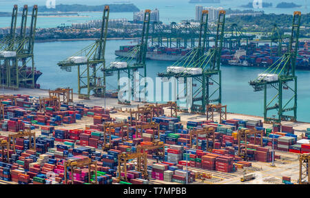 Cranes and shipping containers at Port of Singapore at Keppel Harbour Singapore. Stock Photo