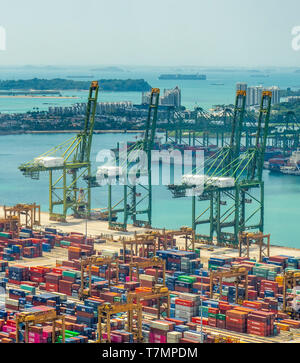 Cranes and shipping containers at Port of Singapore at Keppel Harbour Singapore. Stock Photo