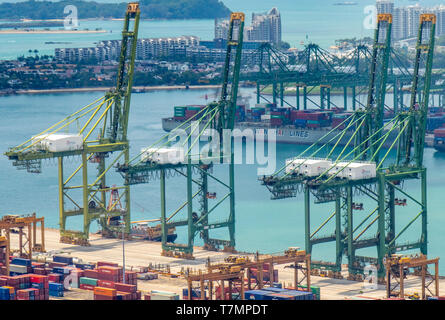 Cranes and shipping containers at Port of Singapore at Keppel Harbour Singapore. Stock Photo