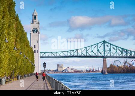 Canada, Quebec, Montreal, The Old Port, Sailor's Memorial Clock Tower and Jacques Cartier Bridge Stock Photo