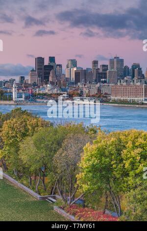 Canada, Quebec, Montreal, elevated city skyline from the St. Lawrence River, dawn Stock Photo