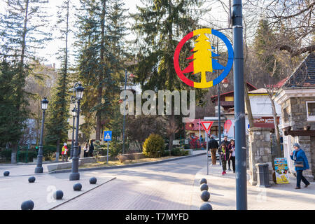 Sinaia, Romania - March 09, 2019: Mountain area / pine tree area sign on light post in Sinaia,  Prahova county, Romania. Stock Photo