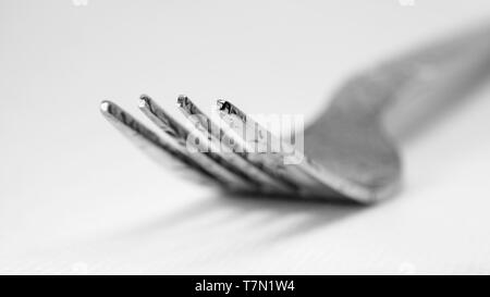 close up of fork lying on table Stock Photo