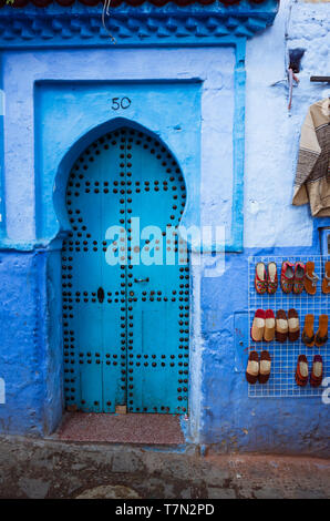 Chefchaouen, Morocco : Traditional wooden door in the blue-washed medina old town. Stock Photo