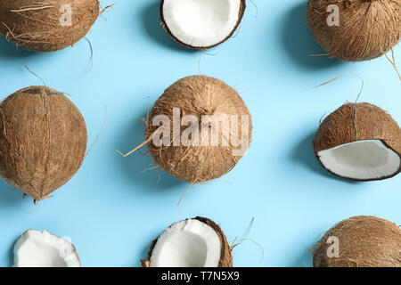 Flat lay composition with coconuts on color background Stock Photo