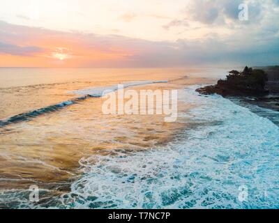 Indonesia, South Bali, Tanah temple lot at sunset (aerial view) Stock Photo