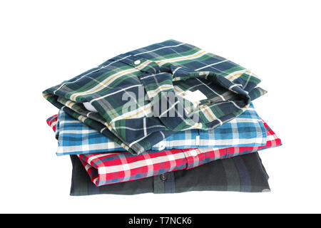 Stack of colorful shirts isolated on white background Stock Photo