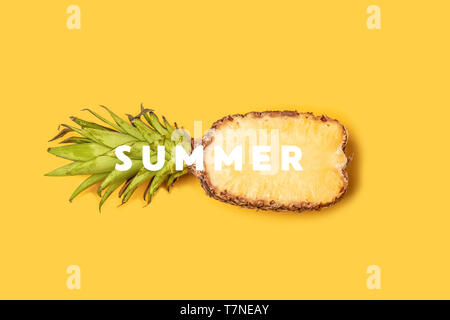 Summer banner composition. Unwrapped pineapple on a yellow background with space for text Stock Photo