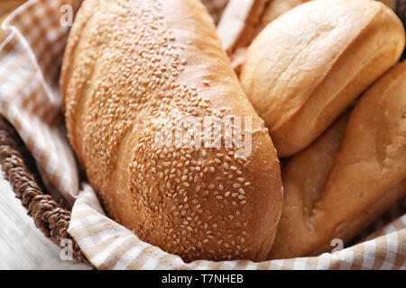 Fresh tasty bread in wicker basket, closeup Stock Photo