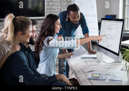 Young architects working on project in office Stock Photo