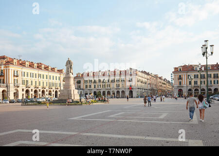 CUNEO, ITALY - AUGUST 13, 2015: Central Galimberti square with people in a summer day, blue sky in Cuneo, Italy. Stock Photo